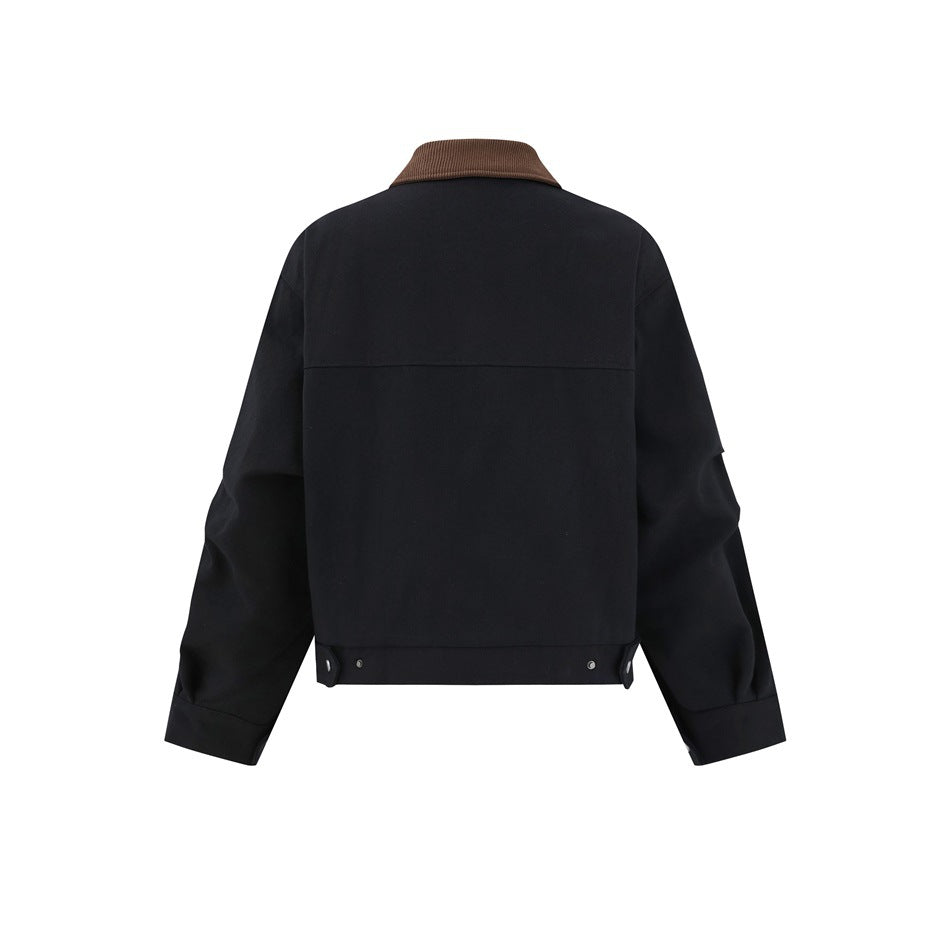 Back view of a black jacket with a brown collar, plain back panel, and snap details at the hem.