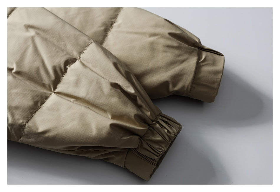 Close-up of the taupe jacket's sleeves and gathered elastic cuffs.