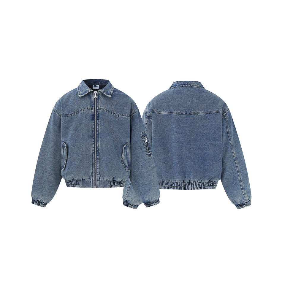 Blue denim jacket shown from the front and back, with a zip front, pockets, and gathered cuffs and hem.