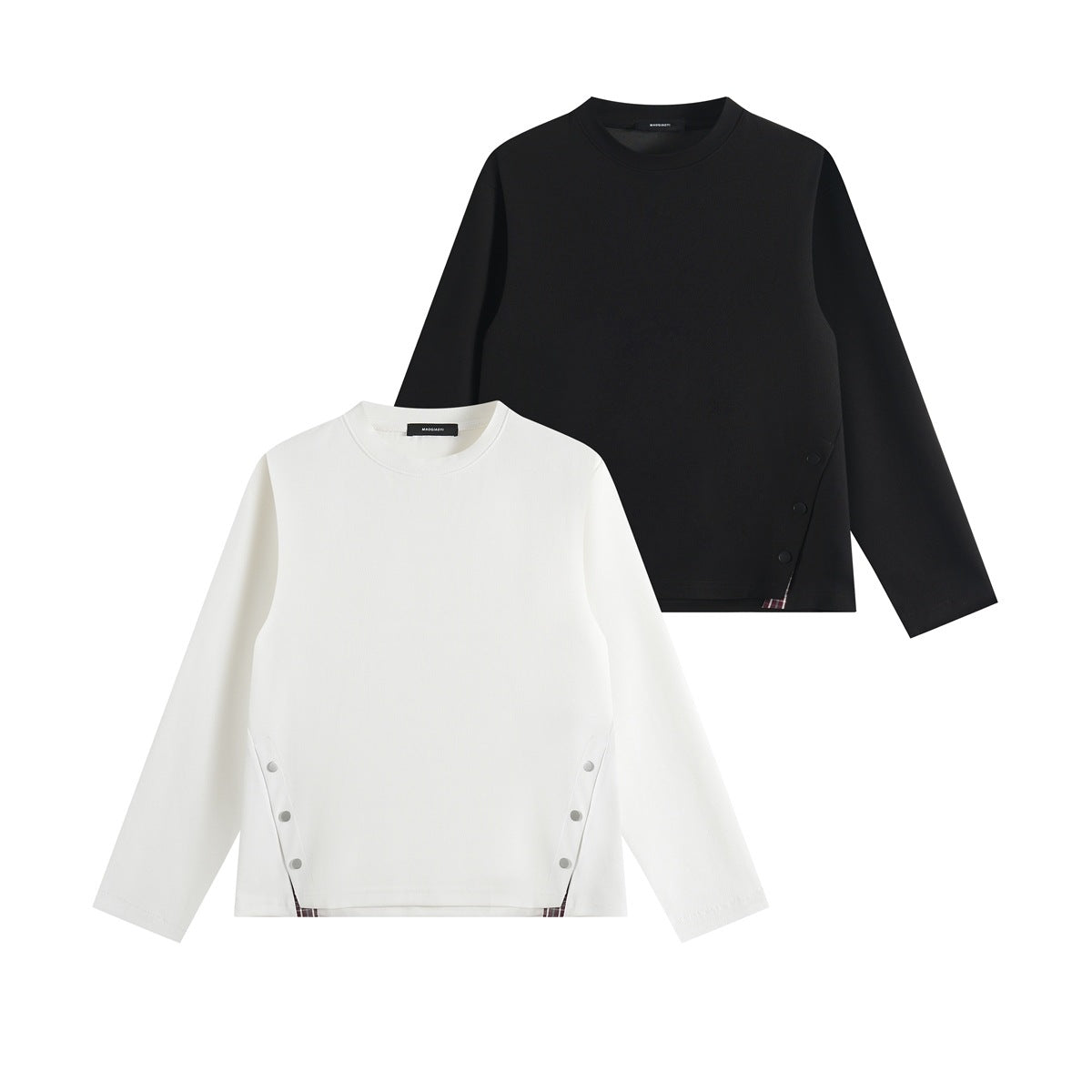 Black and white long-sleeve crew neck tops with side snaps and small plaid accents.