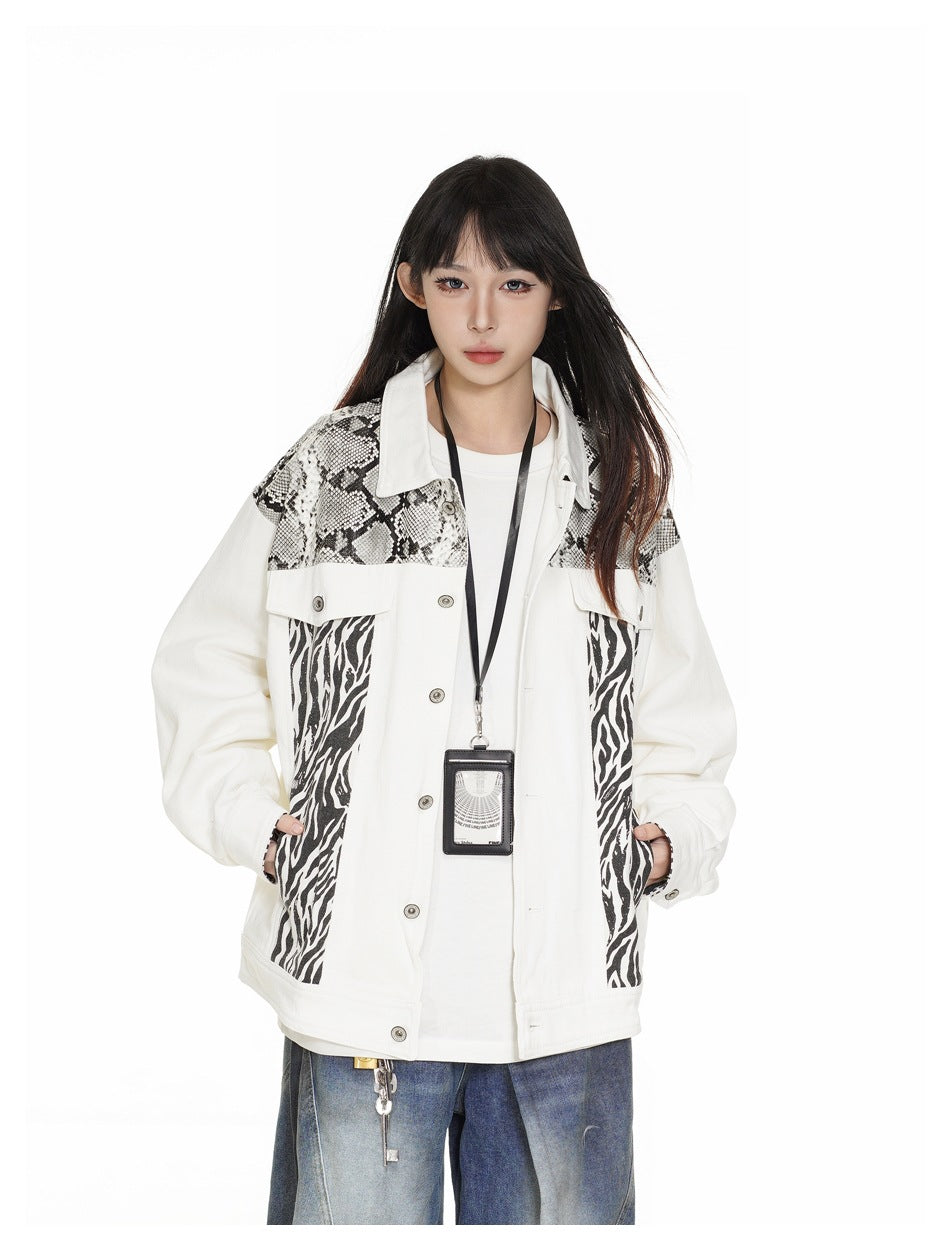 Close-up of a model wearing the white snake and zebra print jacket open over a white tee with a lanyard card holder