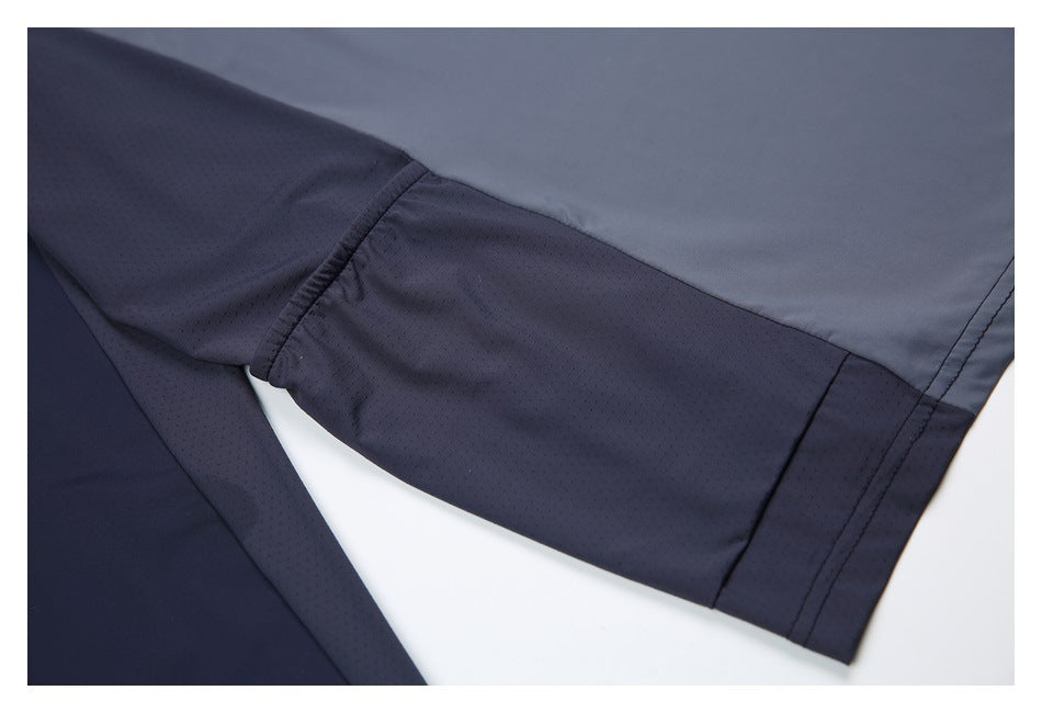 Close-up of a sleeve’s perforated underarm panel, gathered seam, and cuff area.