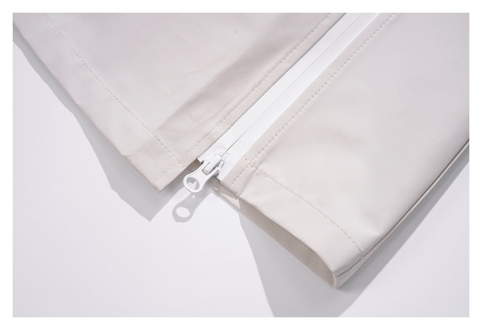 Close-up of the skirt's white zipper near the stitched hem.