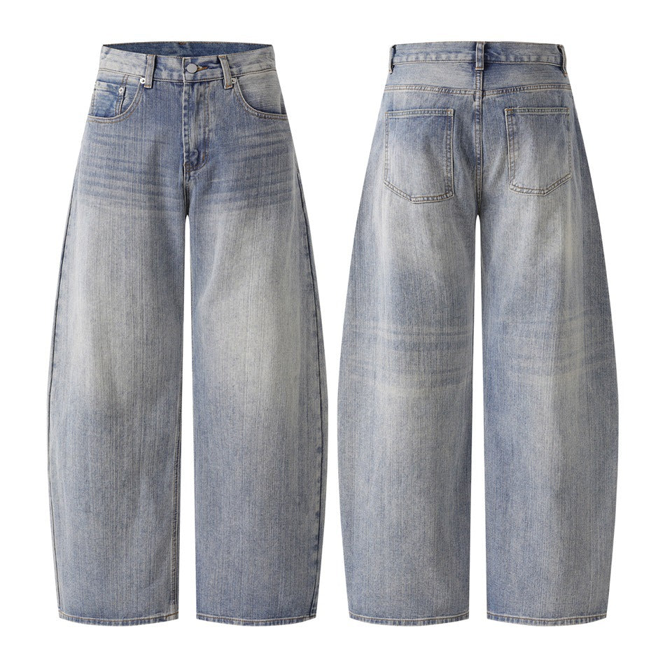 Front and back views of washed blue barrel-leg jeans side by side, showing back patch pockets
