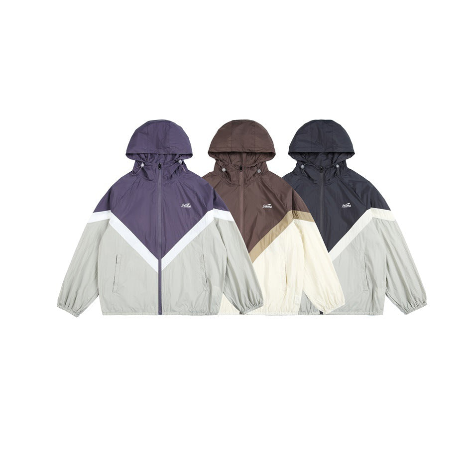 Three hooded colorblock jackets shown from the front in purple and gray, brown and cream, and dark navy and gray.