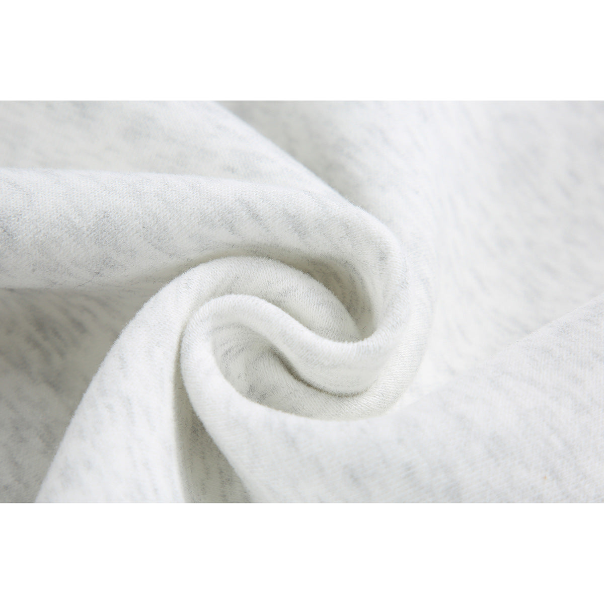 Close-up of the off-white heathered fabric gathered to show its surface texture.