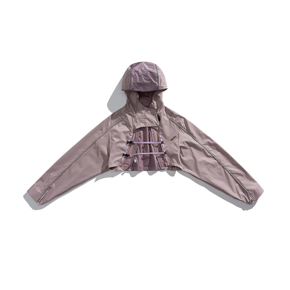 Front view of a dusty mauve hooded cape jacket with wide sleeves and adjustable straps across the chest.