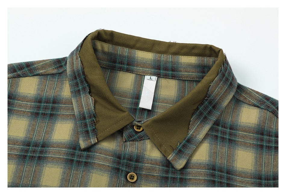 Close-up of the plaid shirt's pointed collar, olive inner collar panels and buttons; size tag marked L.