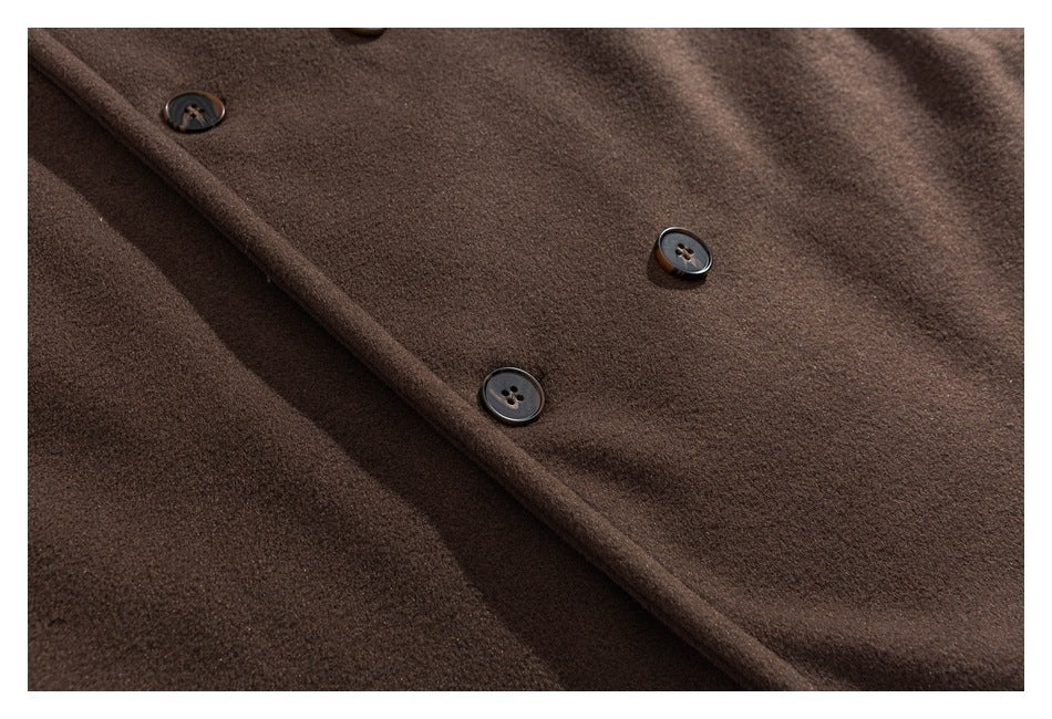 Close-up of the brown coat's buttoned front placket.