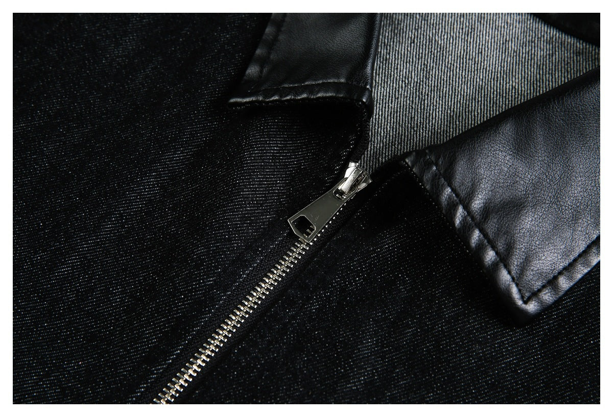 Close-up of a black jacket's silver zipper and glossy faux-leather collar against textured fabric.