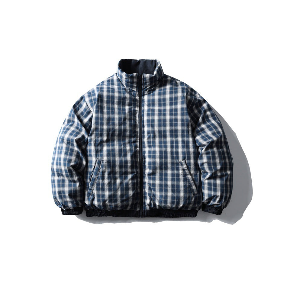 Front view of a blue, gray, and white plaid jacket with a high collar, full zipper, and elastic cuffs and hem.
