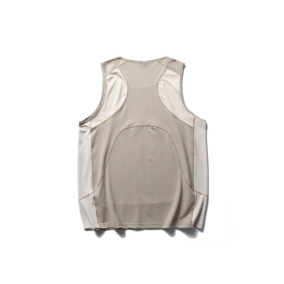 Back view of a light taupe sleeveless top with ivory mesh panels and pale side panels.