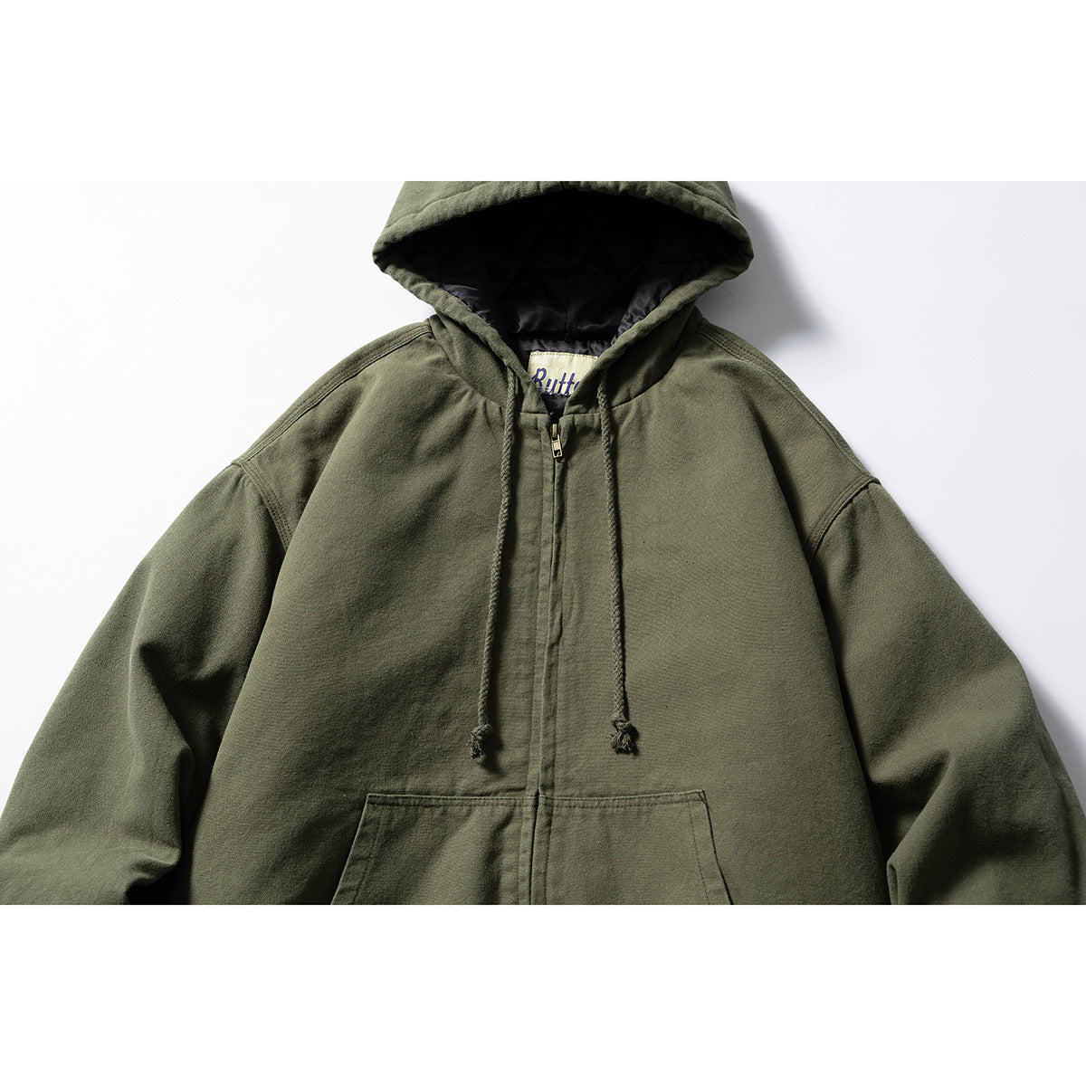 Close front view of an olive hooded zip-up jacket with drawstrings, a kangaroo pocket, and dark hood lining.