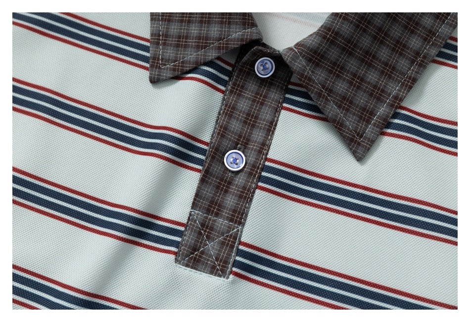 Close-up of two buttons on the brown plaid placket, with the shirt's navy and red stripes visible.