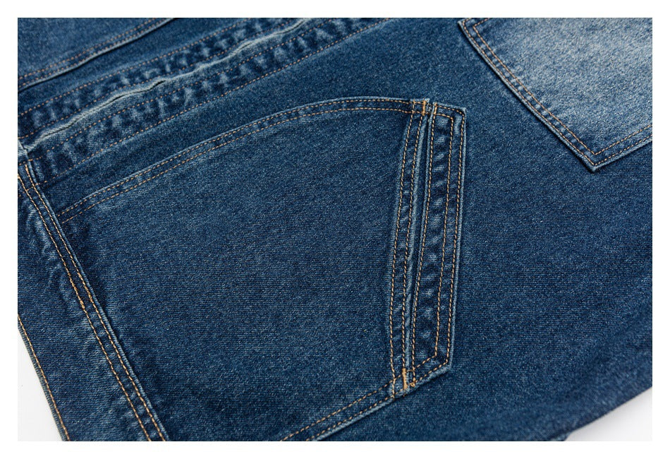 Close-up of a blue denim patch pocket with double rows of tan stitching.