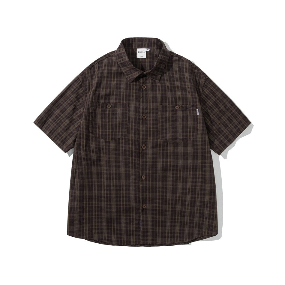 Brown plaid short-sleeve button-up shirt with two flap chest pockets, flat lay front view