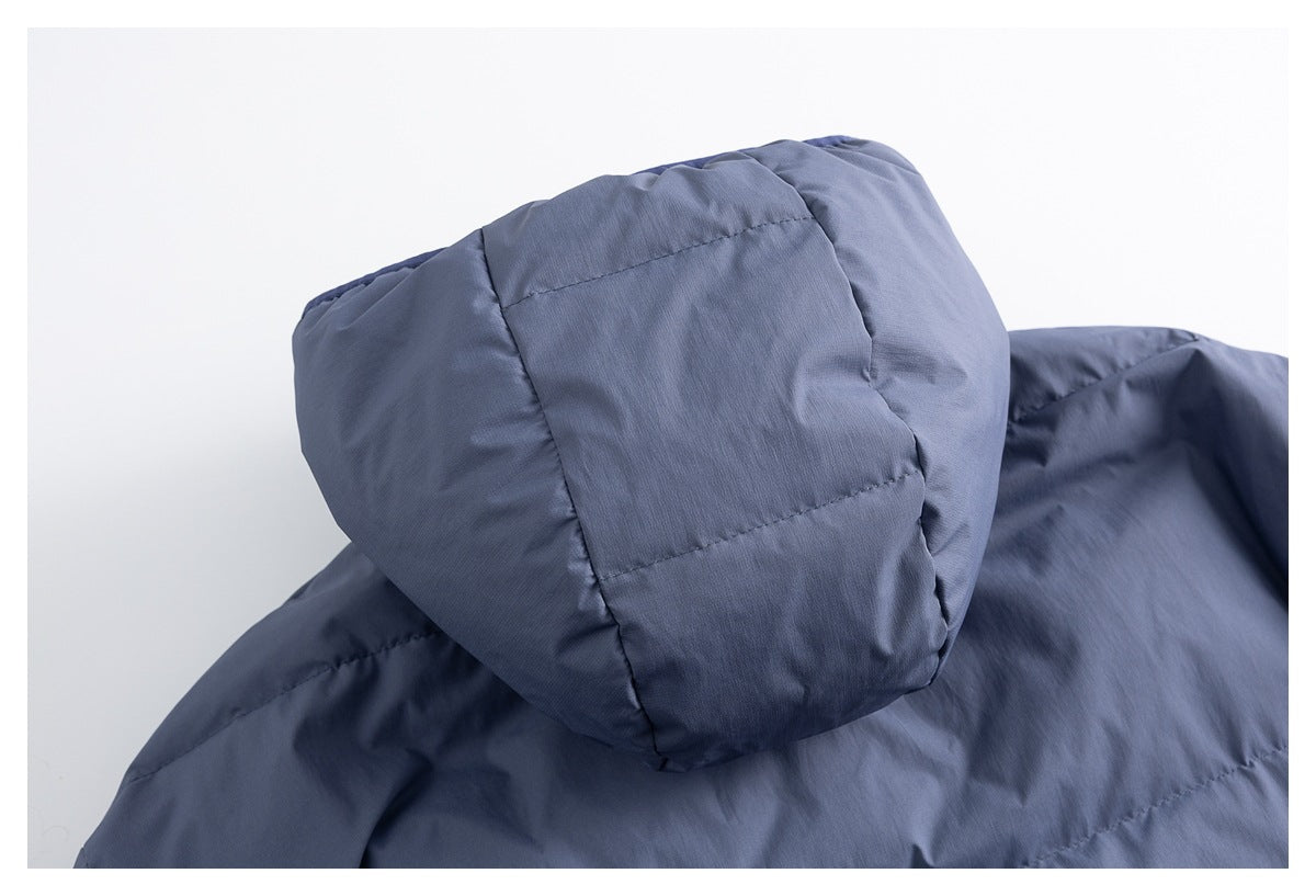 Close-up of the padded blue-gray jacket hood and stitched panels.