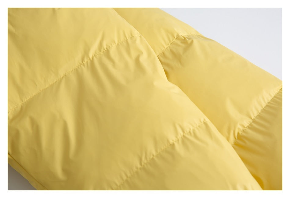 Close-up of the yellow jacket's quilted panels and stitching.