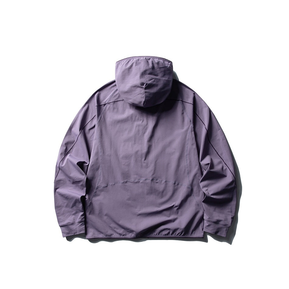 Back view of a muted lavender hooded jacket with seam detailing and long sleeves, laid flat on white.