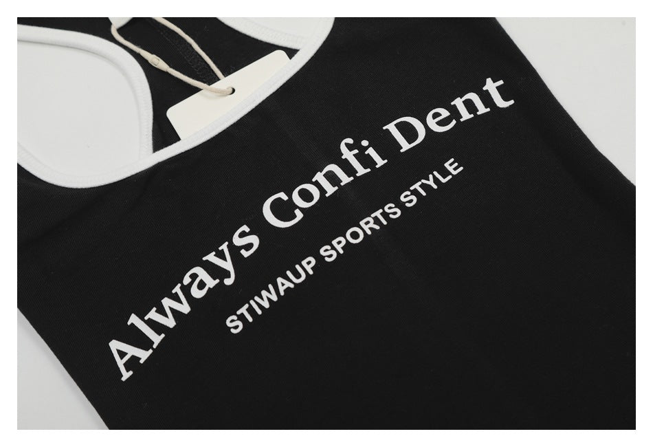 Close-up of a black garment with white trim and white text reading “Always Confident” and “STWAUP SPORTS STYLE.”