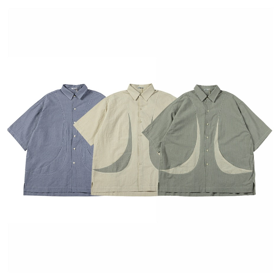 Three short-sleeve button-up shirts in blue-gray, beige, and sage, with fine stripes and curved front panels.