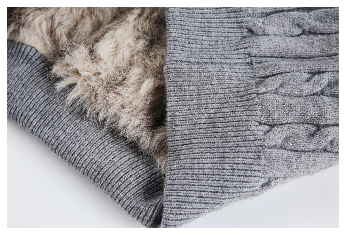 Close-up showing plush beige lining beside the gray sweater's ribbed edge and cable-knit exterior.