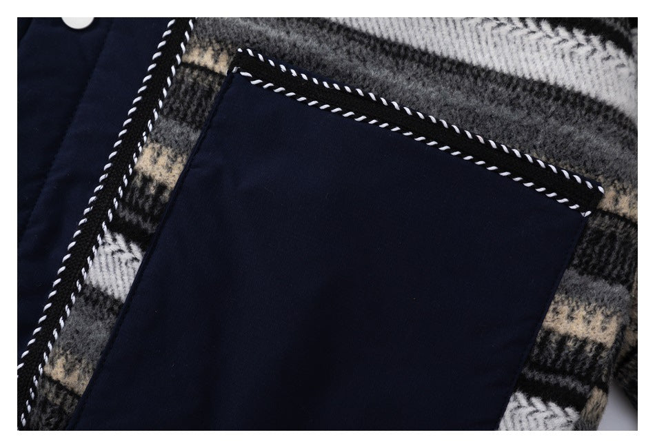 Close-up of a large navy patch pocket with contrasting twisted trim on plaid fabric.