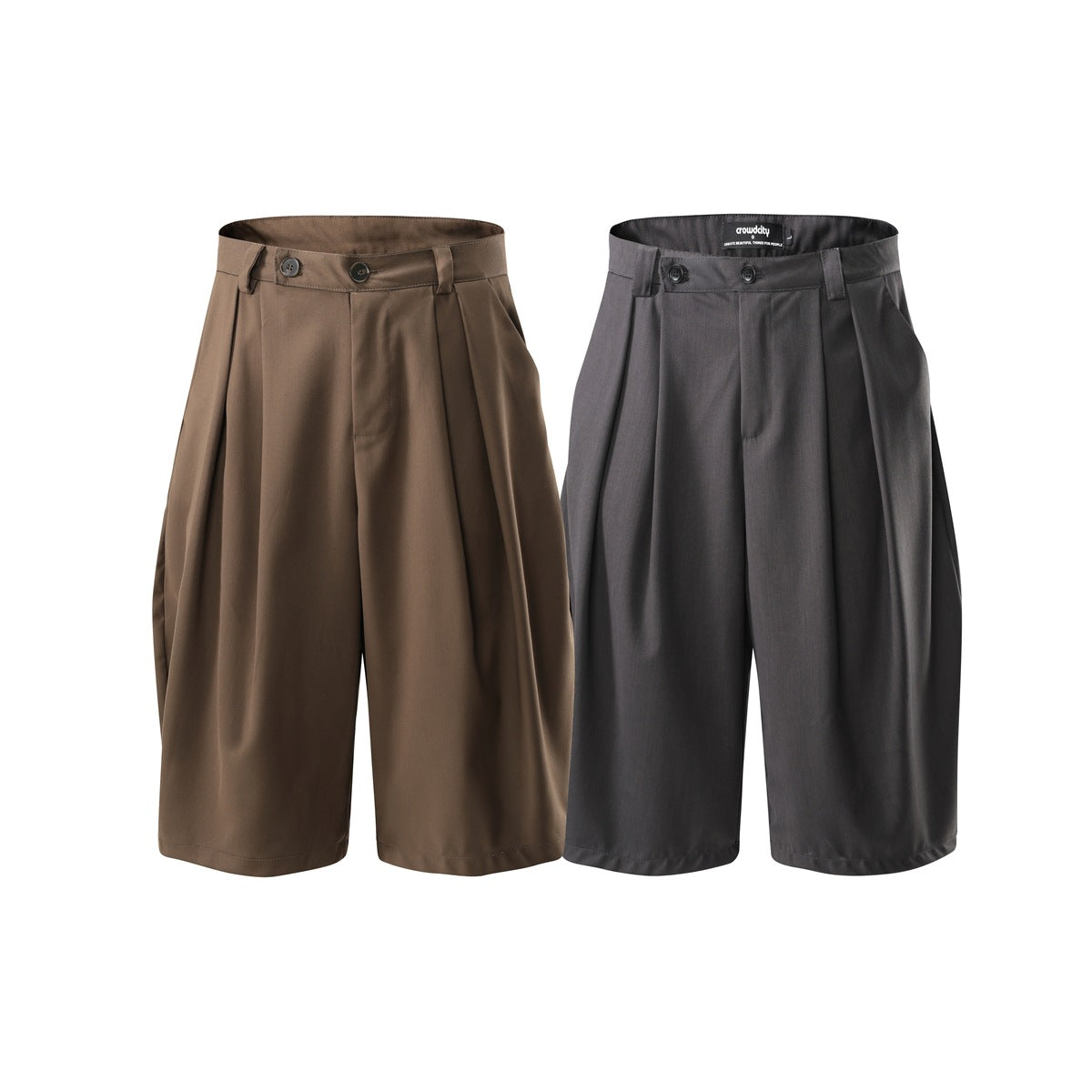 Front view of two pleated, wide-leg shorts, one brown and one charcoal gray.