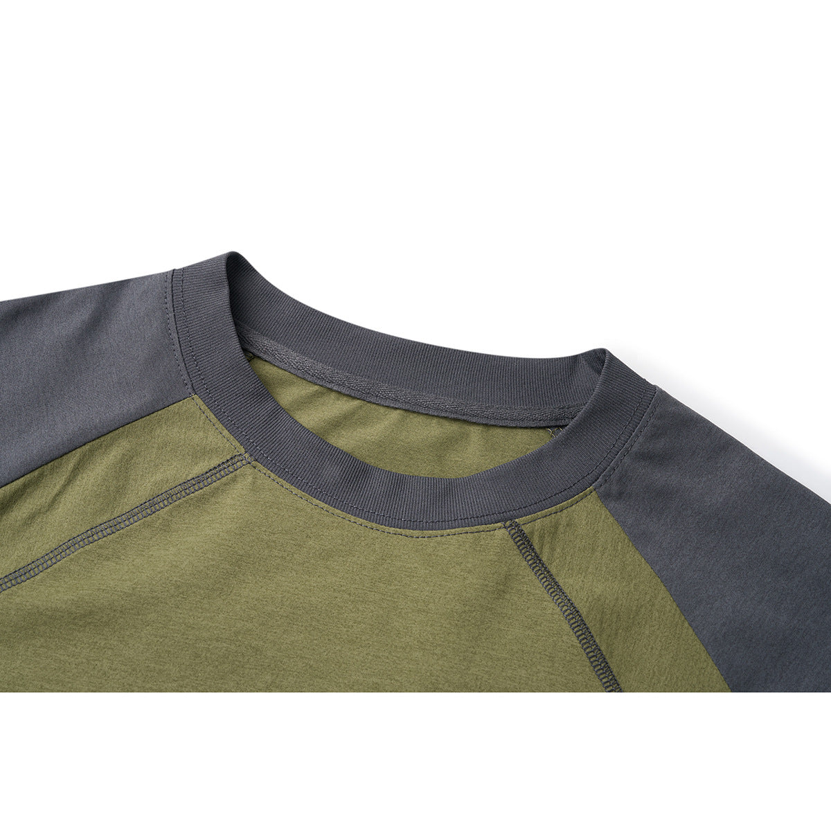 Close-up of an olive-green raglan shirt neckline with a ribbed charcoal-gray collar and contrasting seams.