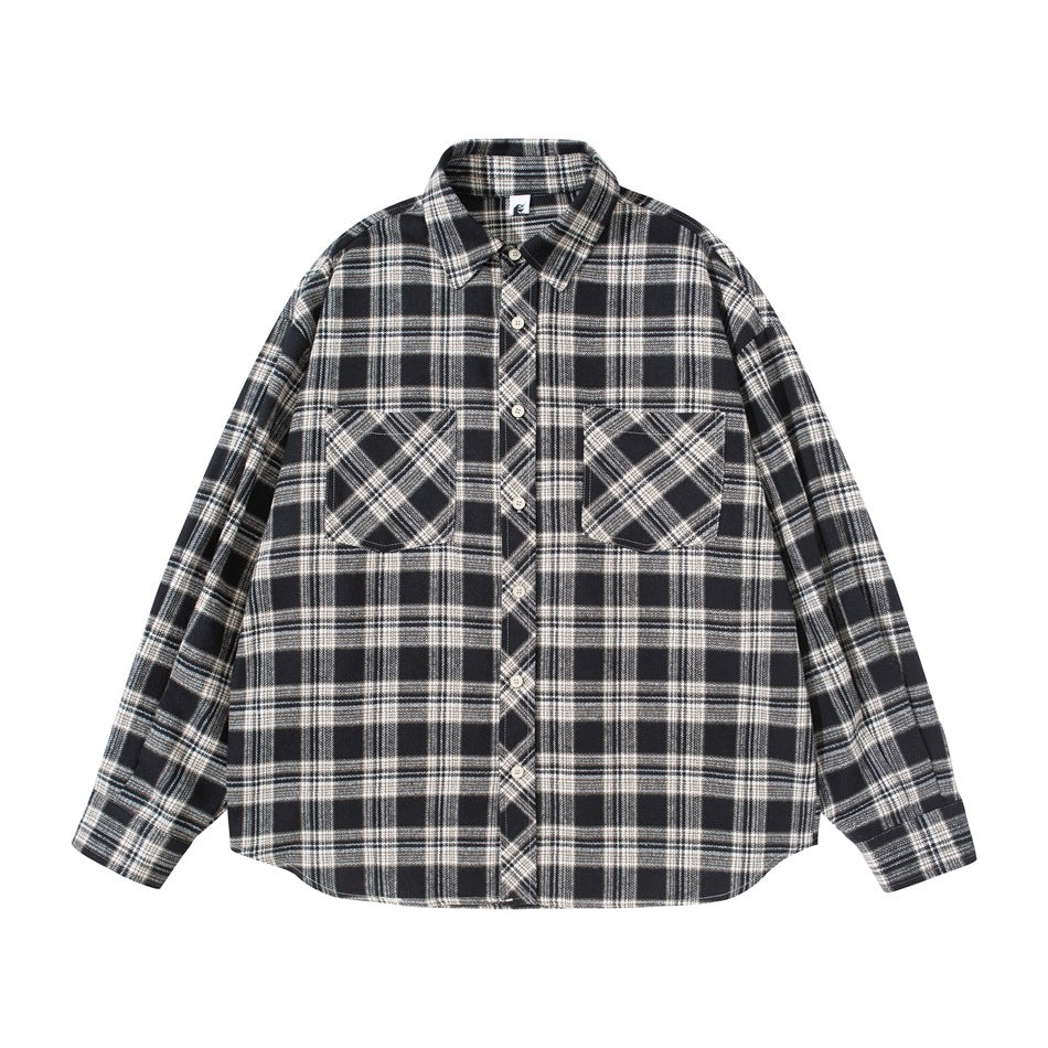 Black and cream plaid long-sleeve button-up shirt with two chest flap pockets, flat lay front view