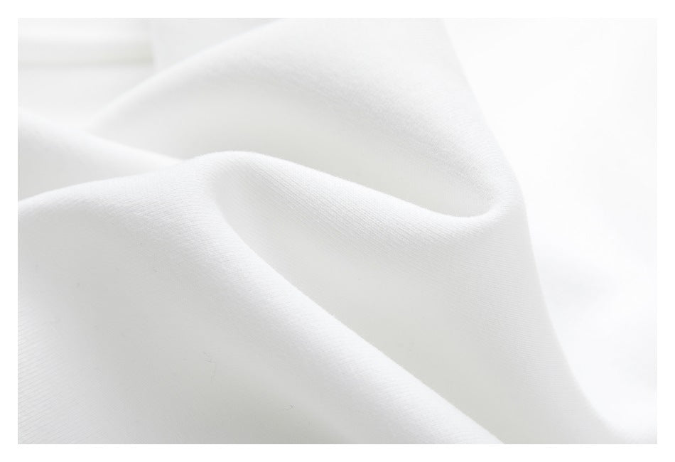Close-up of softly folded white sweatshirt fabric.