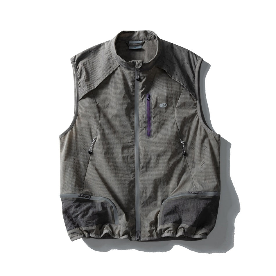 Gray sleeveless zip vest with stand collar, purple chest zip pocket and dark gray lower mesh-panel pockets, front view