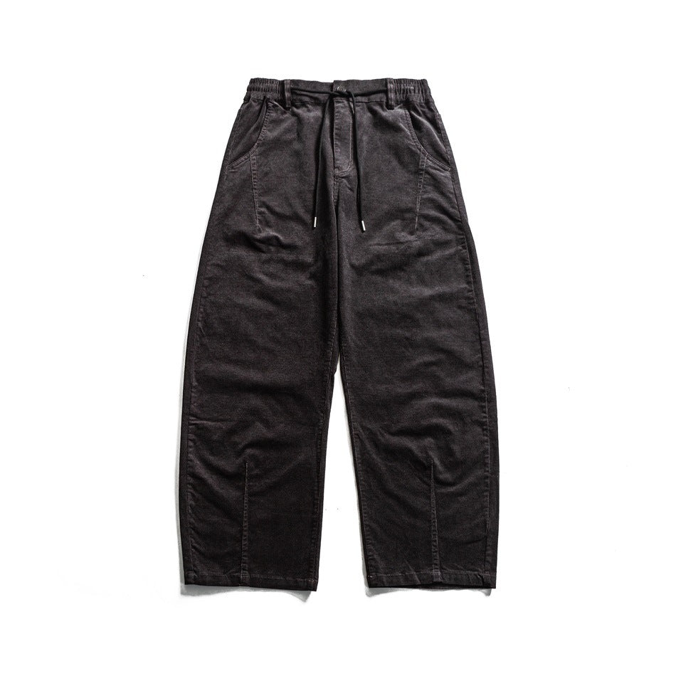 Black wide-leg corduroy-style pants with drawstring elastic waist and front hem slits, flat lay