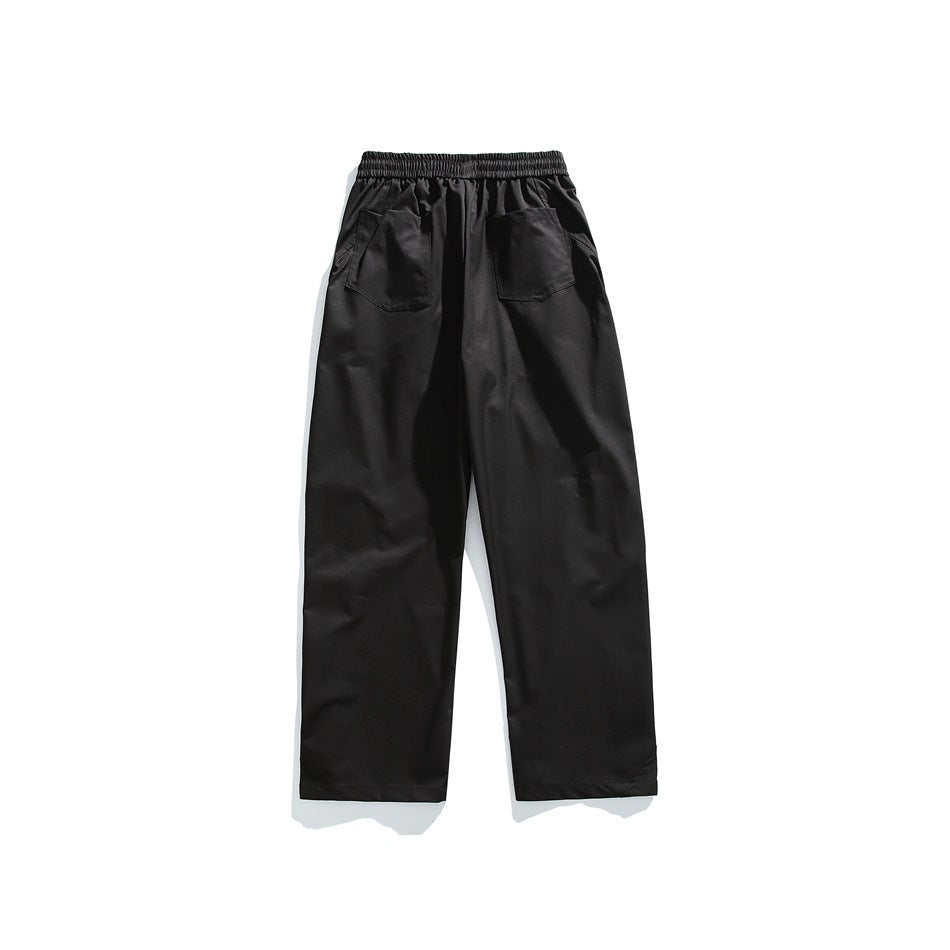 Back view of black wide-leg pants with elastic waistband and two patch back pockets