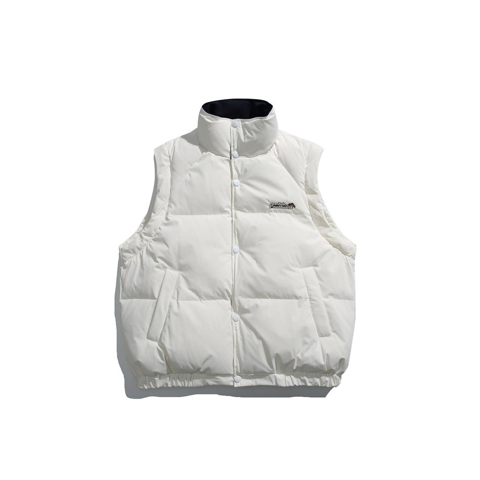 Front view of an ivory padded vest with a high collar, snap closure, and two slanted pockets.