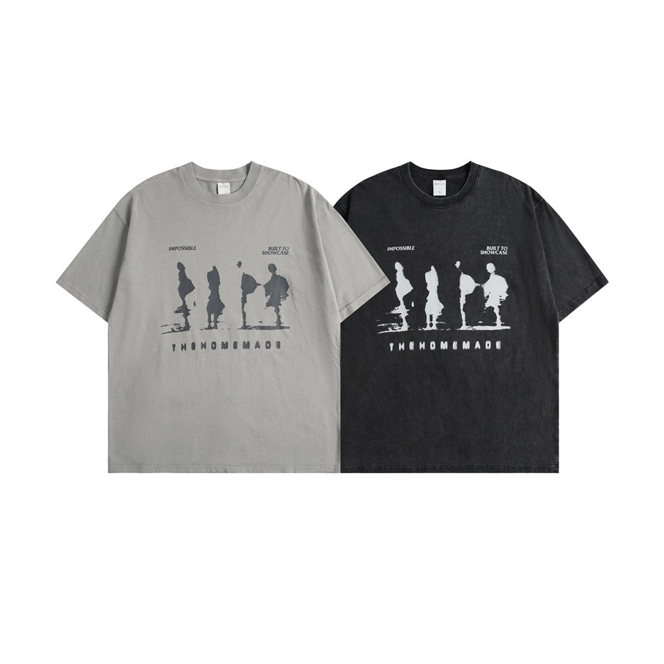 Two short-sleeve graphic T-shirts shown from the front in light gray and black.
