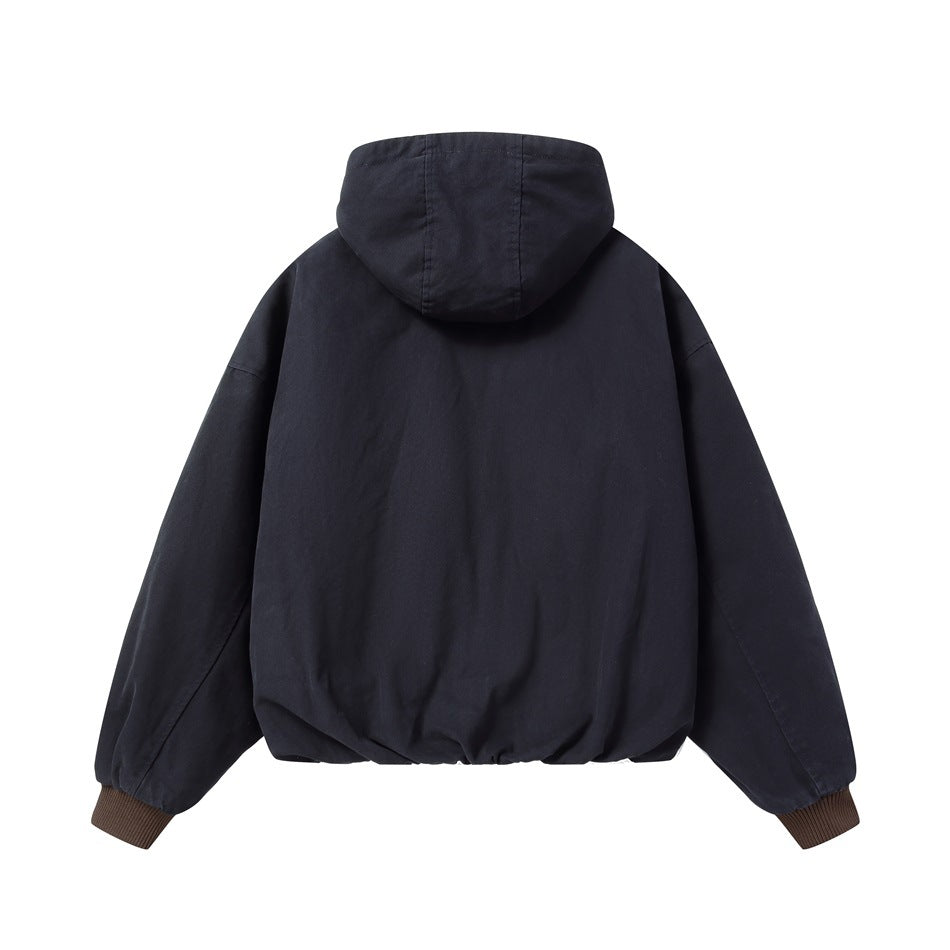 Back view of a dark navy hooded jacket with a plain body and brown ribbed cuffs.