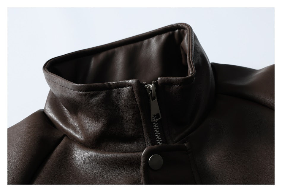 Close-up of a dark brown jacket's stand collar, front zipper and snap-fastened storm flap.