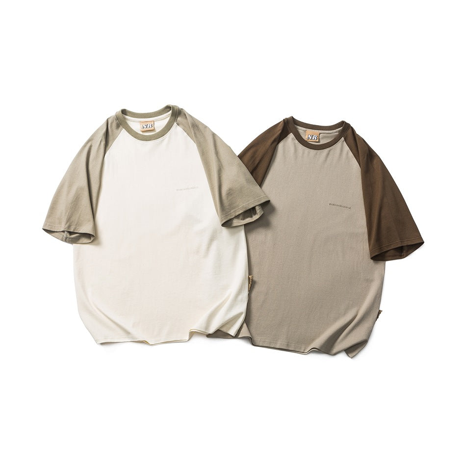 Two short-sleeve raglan T-shirts laid flat: one cream with taupe sleeves and one taupe with brown sleeves.