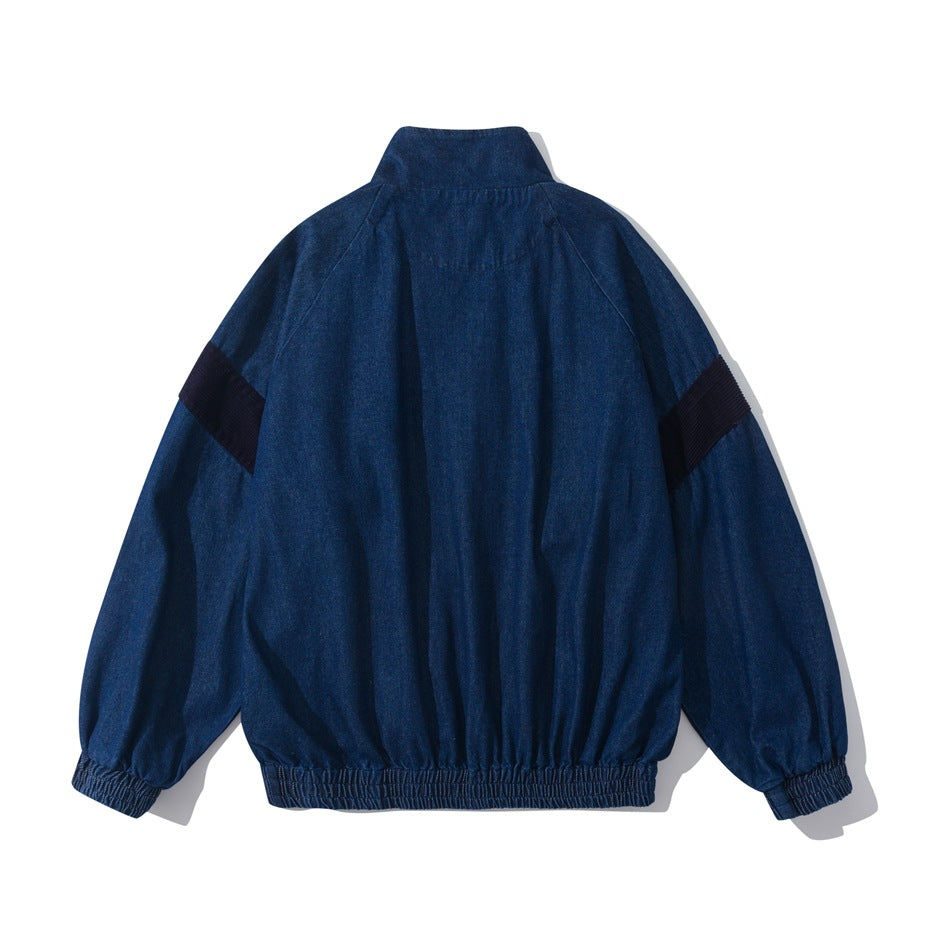 Back view of a blue jacket with dark bands across the sleeves and elastic cuffs and hem.