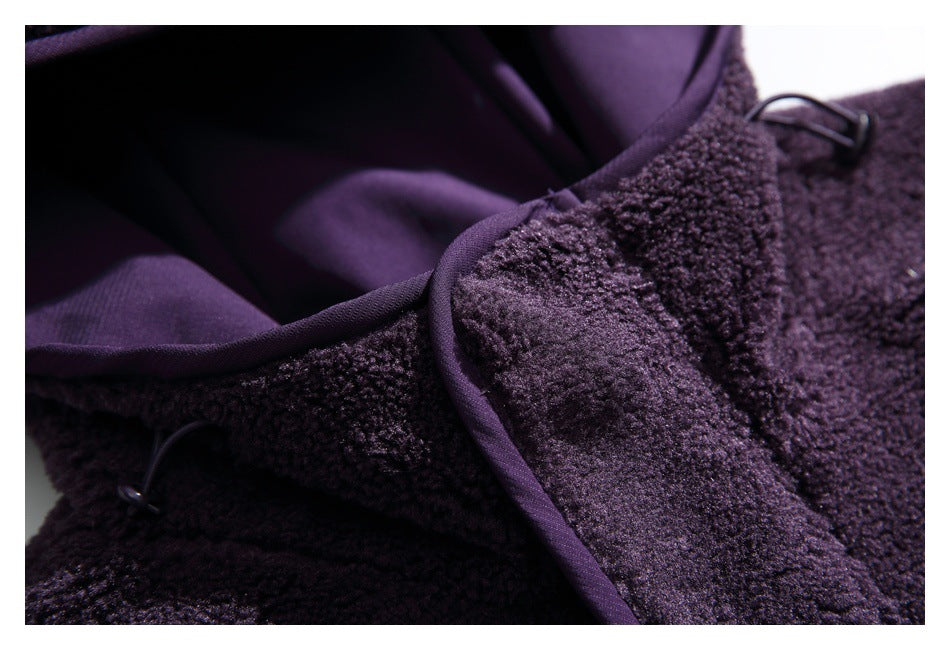 Close-up of the jacket's purple-lined hood, fleece edge binding, and small dark loop fasteners.