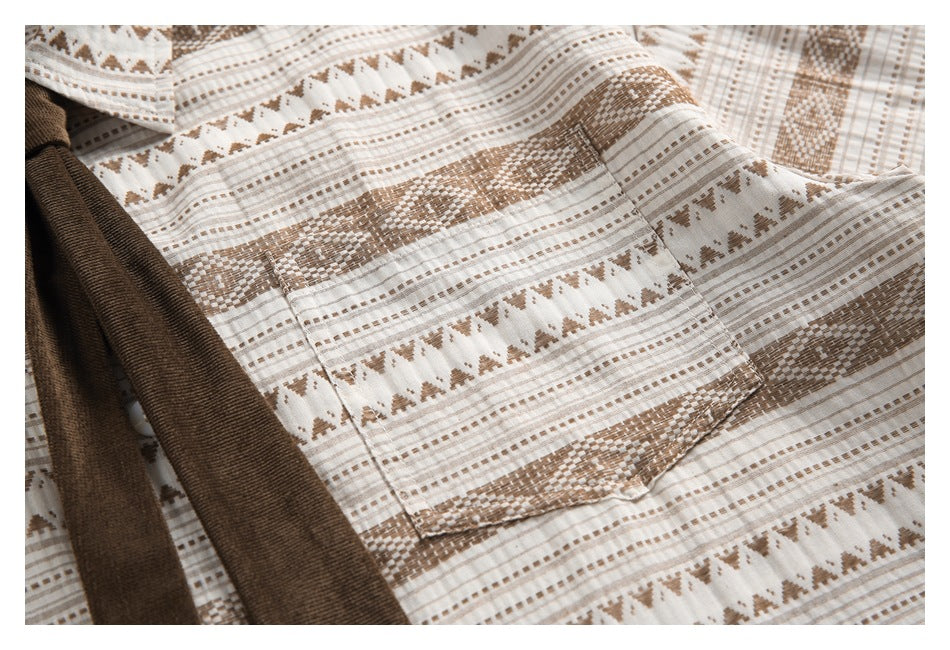Close-up of a rectangular chest pocket on the cream-and-tan geometric patterned shirt.