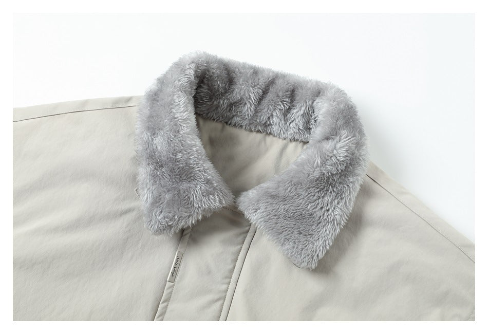 Close-up of the light gray jacket's plush collar and front closure.