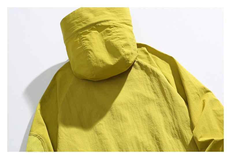 Close-up of the yellow-green jacket's hood and upper back.