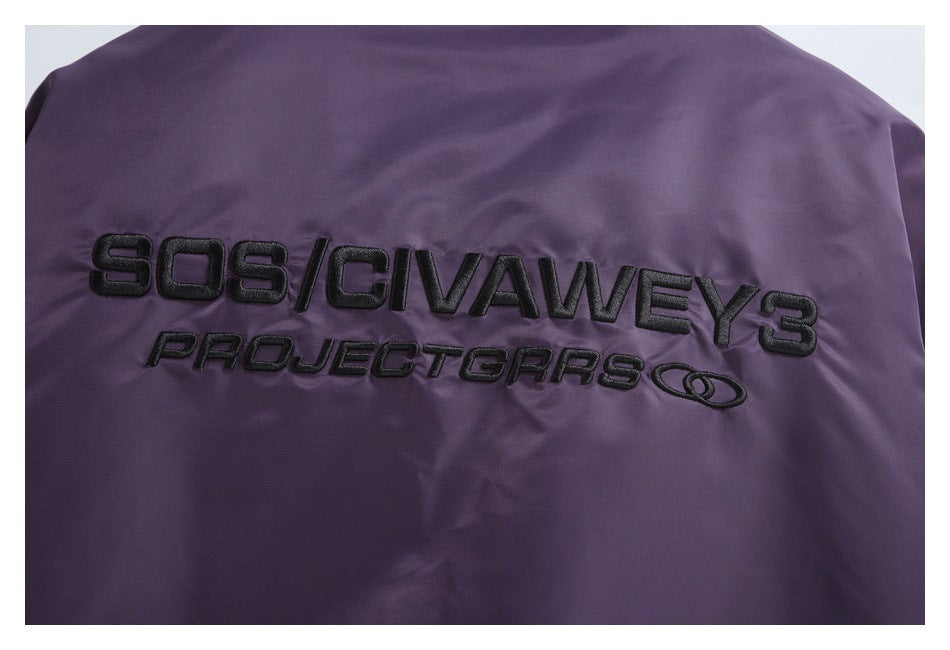Black embroidered lettering decorates the back of a dark purple jacket.