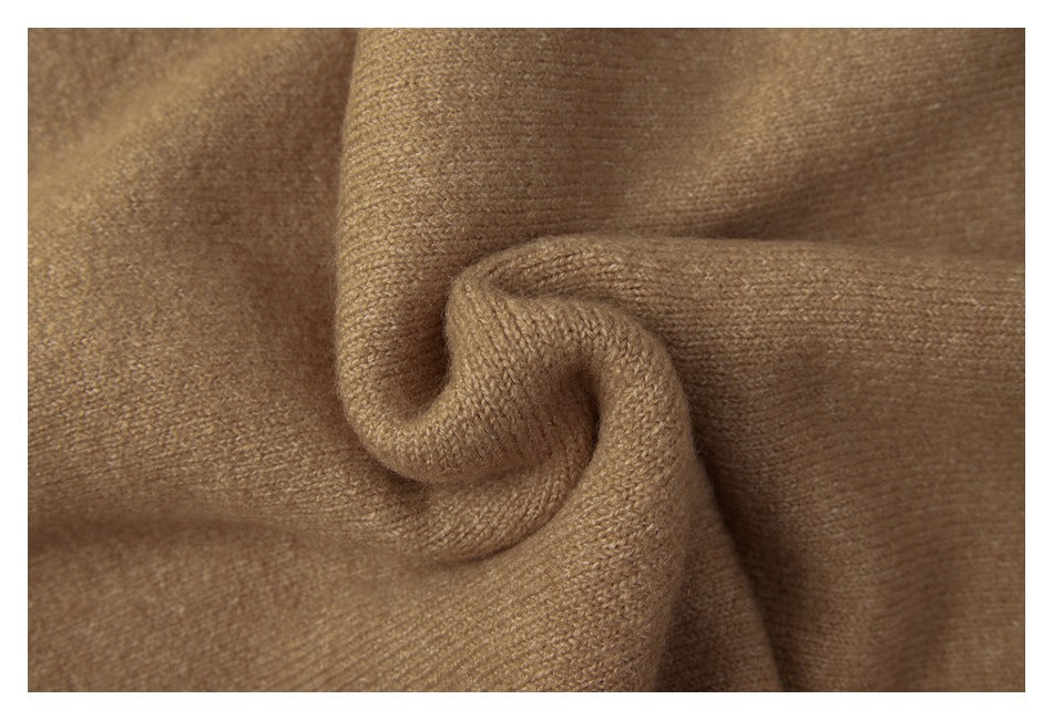 Close-up of camel-brown knit fabric gathered into a soft fold.