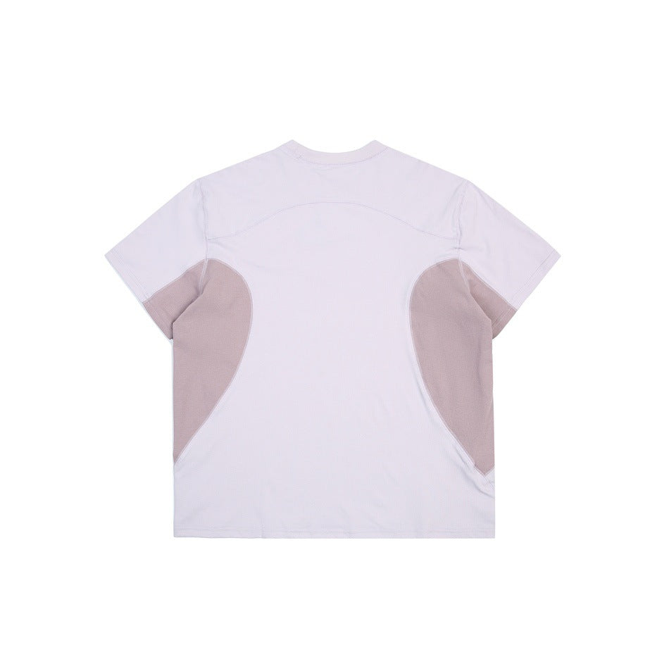 Back of a light lavender short-sleeve shirt with curved taupe side panels.
