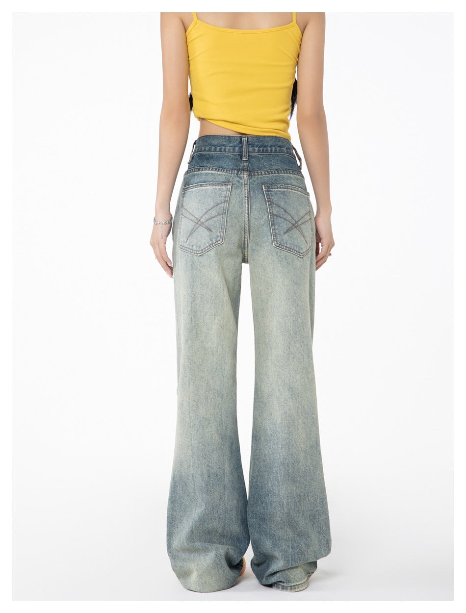 Back view of a model wearing light-wash wide-leg jeans with rear patch pockets and a yellow camisole.