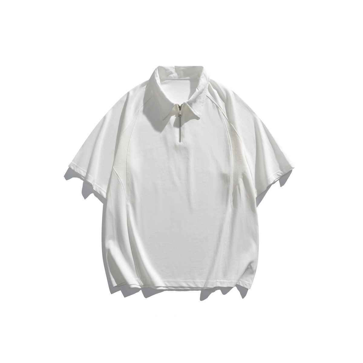 White short-sleeve polo-style top with half-zip collar and raglan sleeves, flat lay front view