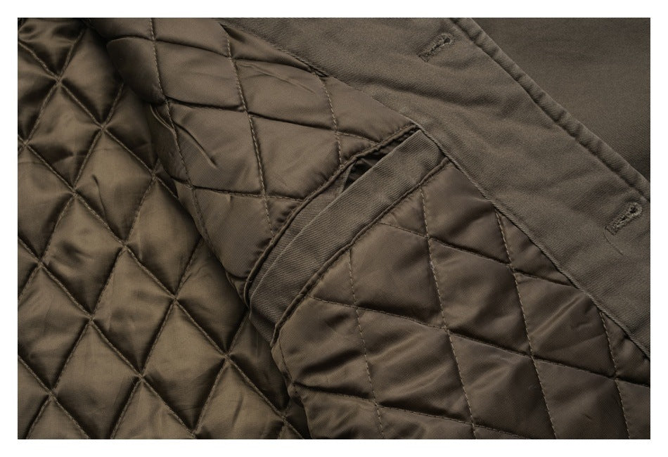 Close-up of the jacket's brown diamond-quilted lining and interior seam details.